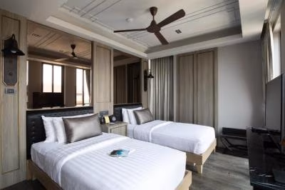 Two Bedroom Premier (1 King + 2 Single Beds)